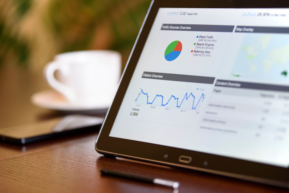 Tablet displaying a Google Ads-style analytics dashboard