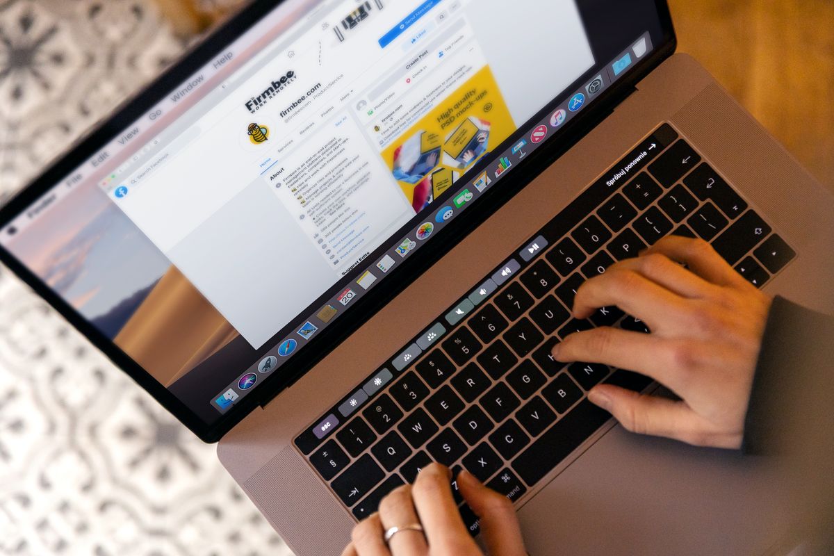 Person typing on a laptop running an outreach campaign