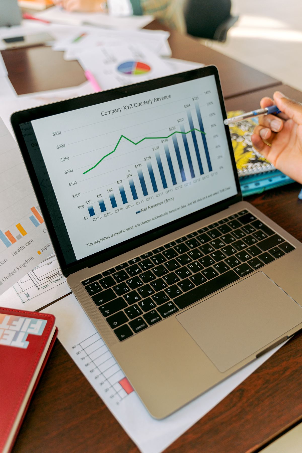 Laptop displaying a quarterly revenue chart